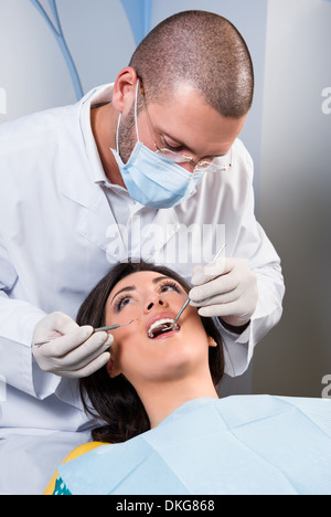 Dentist examined patient's teeth Stock Photo - Alamy