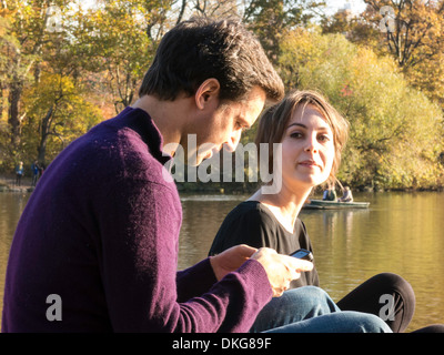 Young Couple Enjoying an Autumn Afternoon in Central Park, NYC Stock Photo