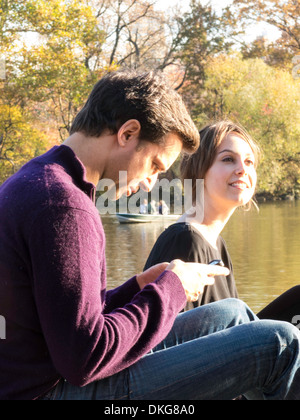 Young Couple Enjoying an Autumn Afternoon in Central Park, NYC Stock Photo