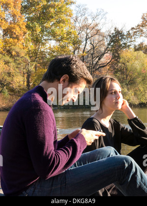 Young Couple Enjoying an Autumn Afternoon in Central Park, NYC Stock Photo