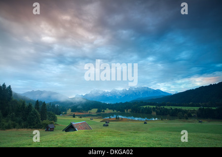 sunrise over Geroldsee lake and alpine meadows, Bavaria, Germany Stock Photo