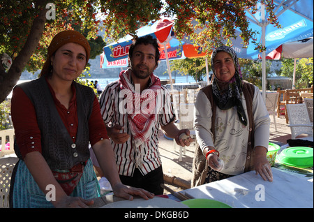 Three villagers making gozleme in Halfeti, Sanliurfa province, south east Turkey Stock Photo