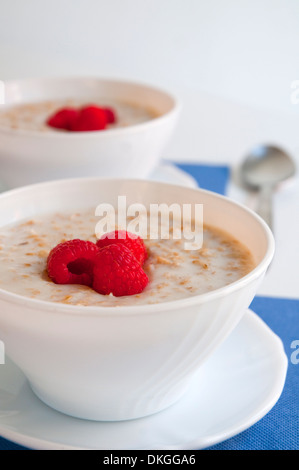 Porridge with raspberries. Close view. Stock Photo