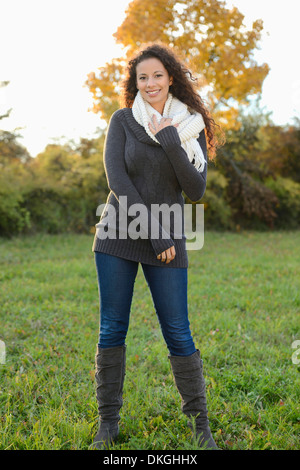 Smiling young woman in autumn Stock Photo