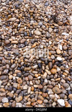 Pebbles can be used as a background, stones are on a UK beach. Stock Photo