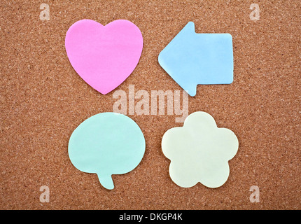 Four Different Sticky Notes on a Notice Board Texture. Stock Photo