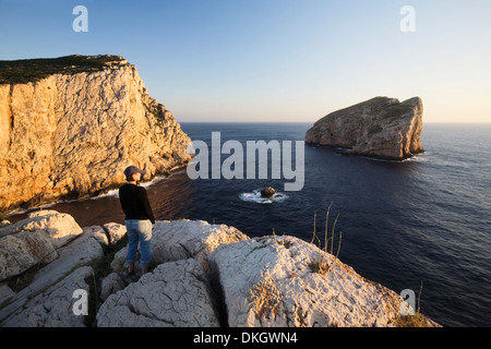Woman enjoying the sunset, Capo Caccia, Province Nurra, Sardinia, Italy, Mediterranean, Europe Stock Photo