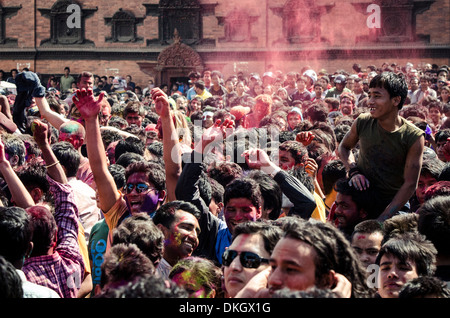 A crowd gathers in Basantapur Durbar Square to celebrate the Holi festival, Kathmandu, Nepal, Asia Stock Photo