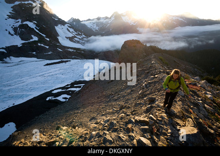 Woman hiking near Mount Olympus and Blue Glacier, Olympic National Park, UNESCO World Heritage Site, Washington State, USA Stock Photo