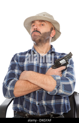 dangerous man with gun sit on chair Stock Photo