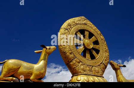 Golden Wheel of Dharma and deer sculptures on the sacred Jokhang Temple roof, Barkhor Square, Lhasa, Tibet, China, Asia