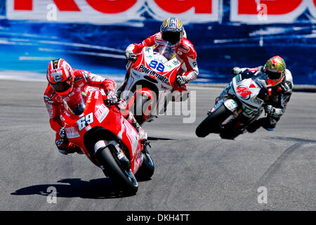July 03, 2009 - Monterey, California, USA - 03 July 2009: Nicky Hayden, of USA, rides the #69 motorcycle for the Ducati Team, Niccolo Canepa, of Italy, rides the #88 Ducati for the Pramac Team, and Gabor Talmacsi, of Hungary, rides the #41 Honda motorcycle for the Scot Racing Team MotoGP during MotoGP practice at the  Mazda Raceway Laguna Seca, in Monterey, Calif. MotoGP's 8th race Stock Photo