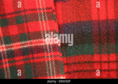 Close up of tartan fabric. Combination of reds, greens, blues & cream. Traditionally Scotish representing clans, Scotland. Stock Photo