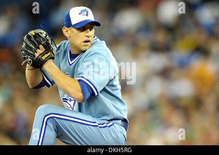 Toronto Blue Jays starting pitcher Roy Halladay pitches during fourth  inning AL action in Toronto on Tuesday July 8, 2003. Blue Jays manager  Carlos Tosca doesn't want Halladay to pitch in the