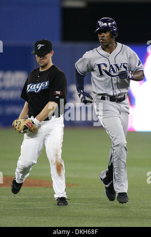Tampa Bay Rays center fielder B.J. Upton (2) tries to make it to second  base as Toronto Blue Jays second baseman Aaron Hill (2) tags him out at the  Rogers Centre in