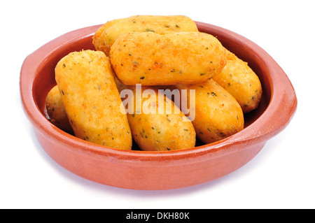 an earthenware bowl with croquetas de bacalao, spanish codfish croquettes, on a white background Stock Photo