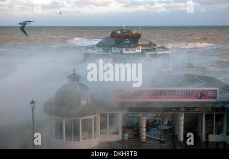 Cromer, Norfolk, UK. 6th December 2013. Waters from a spring high tide at 8.30am inundate the pier at Cromer in Norfolk UK in the strongest storm surge seen since 1953 Credit:  Tim James/The Gray Gallery/Alamy Live News Stock Photo