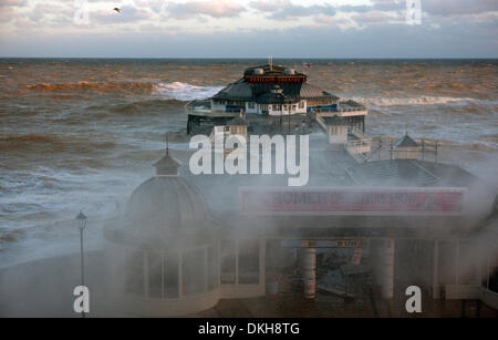 Cromer, Norfolk, UK. 6th December 2013. Waters from a spring high tide at 8.30am inundate the pier at Cromer in Norfolk UK in the strongest storm surge seen since 1953 Credit:  Tim James/The Gray Gallery/Alamy Live News Stock Photo