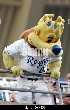 Kansas City, United States. 05th Aug, 2020. Kansas City Royals mascot  Sluggerrr attempts to put a Royals jersey on the cutout likeness of the Marlins  Man at Kaufman Stadium in Kansas City