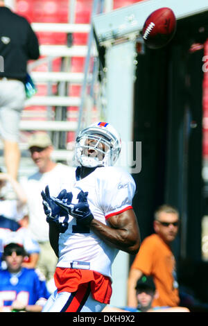 30 July 2009: Wide Reciever Terrell Owens of the Buffalo Bills unveils the  new throwback uniforms after the Bills Thursday night practice at St. John  Fisher College in Pittsford, New York. (Icon