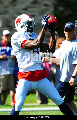 Buffalo Bills wide reciver Terrell Owens (left) signs autograph's for the  fans following the morning session of training camp at St. John Fisher  College in Rochester, NY. (Credit Image: © Michael Johnson/Southcreek