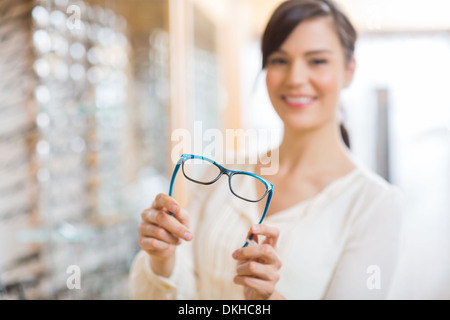 Woman Showing Glasses At Store
