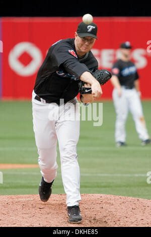 Toronto Blue Jays starting pitcher Roy Halladay #32 and Toronto Blue Jays  second baseman Joe Inglett #1 celebrate a Blue Jays win and Halladay's one  hitter at the Rogers Centre during a