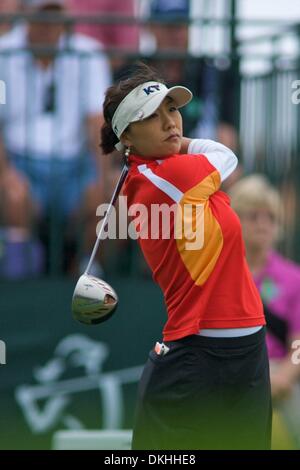 Mi Hyun Kim, of South Korea, tees off on the 11th hole Wednesday, June ...