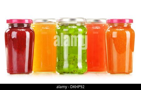 Jars of fruity jams isolated on white background. Preserved fruits Stock Photo