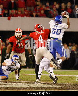 UK's Sam Maxwell (50) intercepted this Georgia pass with under two minutes to play  to seal the UK  34-27 victory in the University of Kentucky vs. Georgia football game in Athens, Georgia on Saturday, Nov. 21, 2009.  Number four is Georgia's Caleb King. Photo by David Perry | Staff  (Credit Image: © Lexington Herald-Leader/ZUMApress.com) Stock Photo