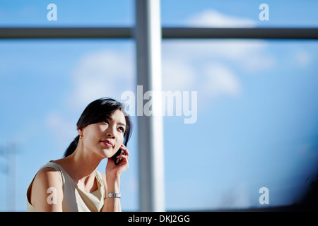 Businesswoman talking on cell phone Stock Photo