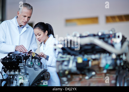 Scientists working on machine Stock Photo