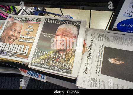 NY, NY, USA. 6th Dec, 2013. New York newspaper covers on Friday, December 6, 2013 report on the death of South African civil rights activist Nelson Mandela at the age of 95. Credit:  Richard Levine/Alamy Live News Stock Photo