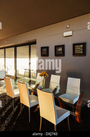 Chairs and table in modern dining room Stock Photo