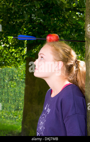 Girl with an apple on her head in which an arrow was shot Stock Photo