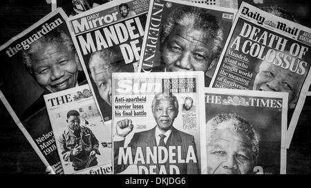 London, UK. 06th Dec 2013. British Newspaper Front Pages Covering The Death of South African anti-apartheid revolutionary, Nelson Rolihlahla Mandela Who Died on the 5th December 2013 at his Home in Johannesburg, South Africa. London UK 6th December 2013. Credit:  Lenscap/Alamy Live News Stock Photo