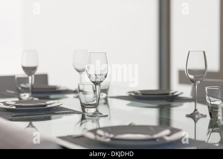 Set table in dining room Stock Photo