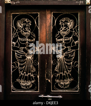 Ornate doorway in Chennai Madras in Tamil Nadu in East india in South Asia. Decorative Decoration Door Doors House Man Woman Art History Travel Stock Photo
