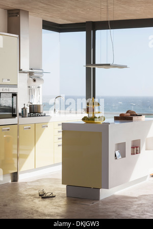 Modern kitchen overlooking ocean Stock Photo