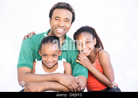 Father spending quality time with daughters on white background Stock Photo