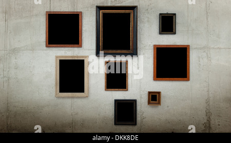 Wooden frames on concrete wall background Stock Photo