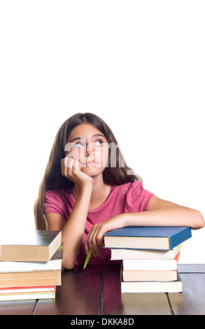 Portrait of a serious schoolgirl looking up. Isolated on white. Stock Photo