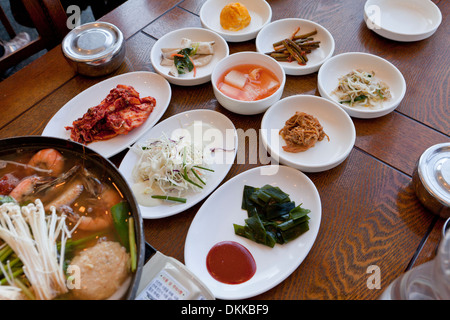Typical Korean side dishes setting at restaurant table - South Korea Stock Photo