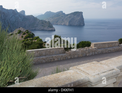 View from Formentor lighthouse towards the dramatic cliffs west of the peninsula. Small boats in the distance. Majorca Stock Photo
