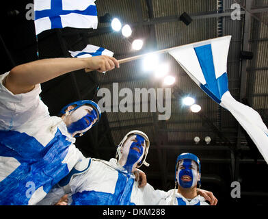 Feb 25, 2010 - Vancouver, British Columbia, Canada - Face painted Finnish fans MARKUS KEKKONEN, HEIKKI MELLA-AHO, and JUSSI KURTTI cheer for their home team during the Men's Hockey game between Finland (FIN) and the Czech Republic (CZE) Wednesday evening in Thunderbird Arena during the 2010 Winter Olympic Games in Vancouver, Canada. Finland defeated Czech 2-0. (Credit Image: © Patr Stock Photo
