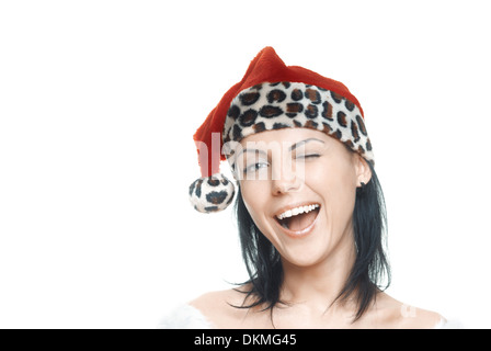 Woman in Santa Claus costume winking and laughing on a white background Stock Photo