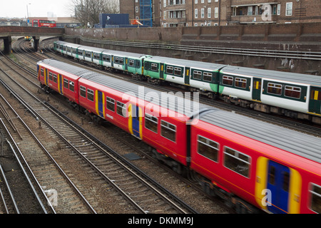 Trains leave Clapham Junction station Stock Photo