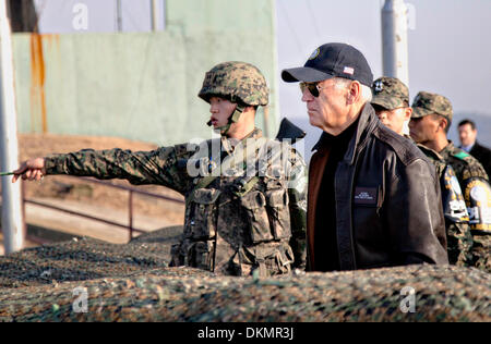 South Korean Army 1st Lt. Choi Min Kyu points across the boarder into North Korea while briefing Vice President Joe Biden at Observation Point Ouellette December 7, 2013 near Wonju, South Korea. Stock Photo