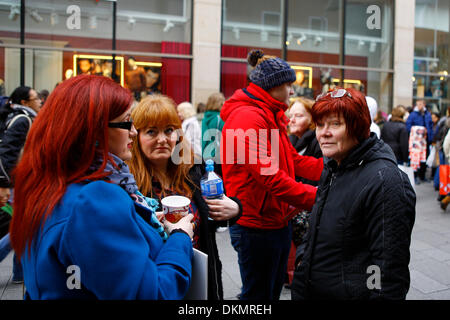Dublin, Ireland. 7th December 2013. United Left Alliance TD (Irish Member of Parliament) Joan Collins talks with striking Mandate members outside Marks & Spencer's Mary Street store in Dublin. Over 2000 Marks & Spencer employee from the MANDATE Trade Union went on their first of 3 strike days, closing all 17 Irish M & S stores. The strike is over the unilateral closing of the defined pension benefit scheme by Marks & Spencer in October. Credit:  Michael Debets/Alamy Live News Stock Photo