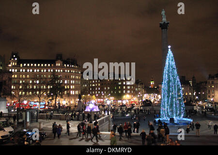 London, England, UK. 06 December 2013. The countdown to Christmas has begun with the traditional tree gifted from Norway covered in festive lights in Trafalgar Square in front of Nelsons Column and Big Ben. Credit:  Julia Gavin/Alamy Live News Stock Photo